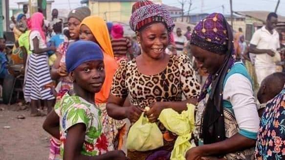 Ghanian citizens receive food distributed by the government during the Corona Virus Pandemic. Photo courtesy of Coverghana.com: https://coverghana.com/covid-19-ghana-govt-distributes-free-food-to-the-poor-and-vulnerable-at-lockdown-areas/