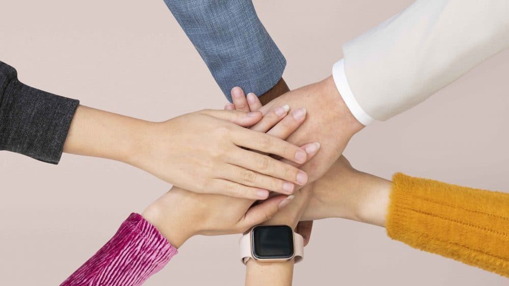Illustrative image of different hands united in a teamwork concept. Picture courtesy of Unsplash.com
