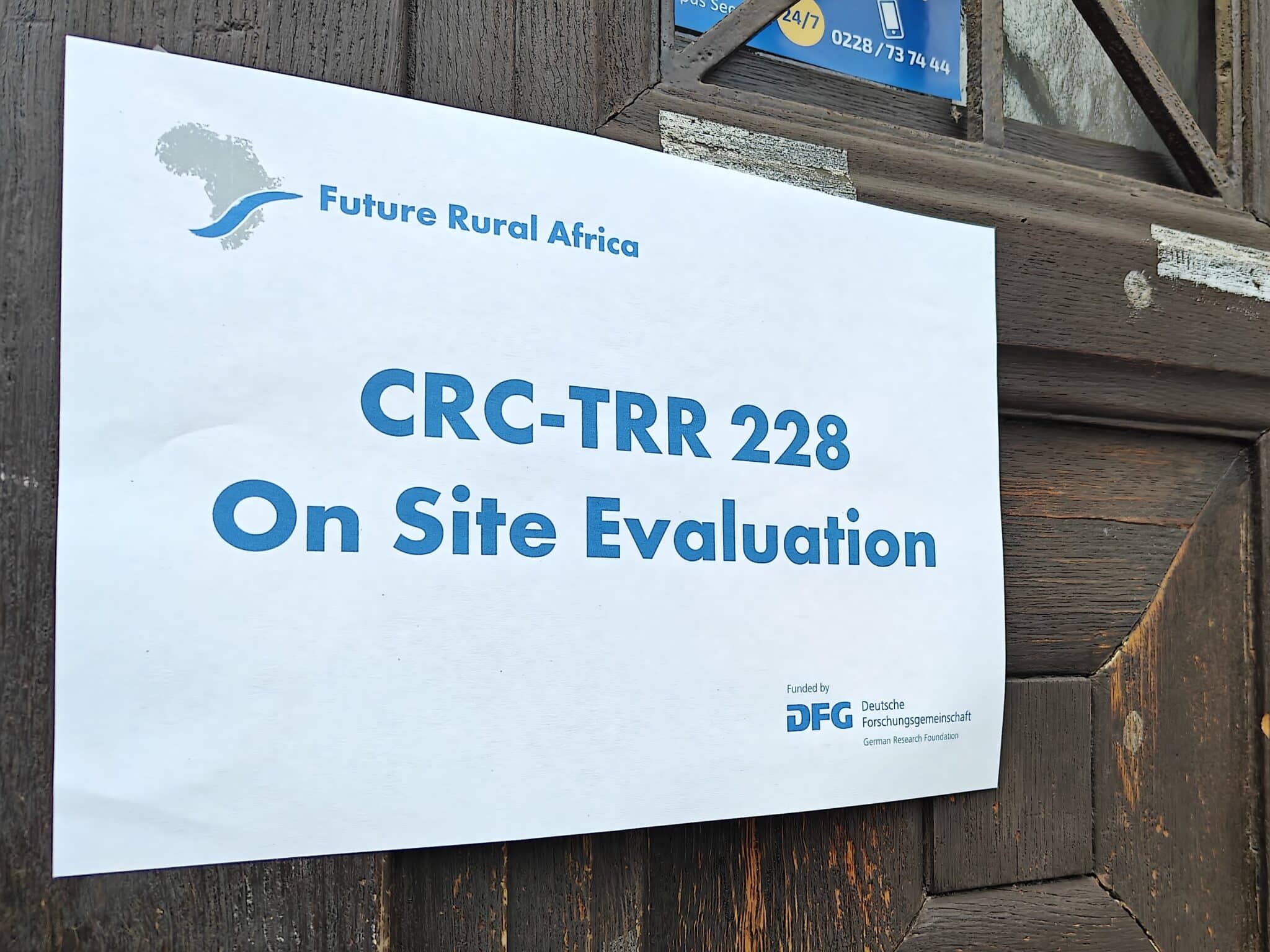 photograph of a sign that reads "crc-trr 228 on site evaluation"