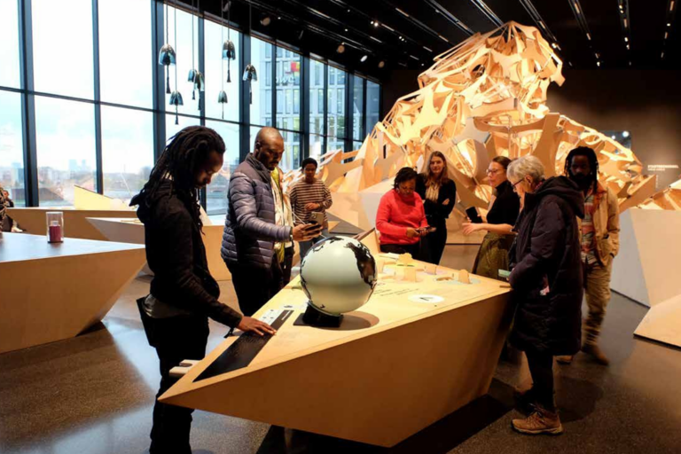 group of people at a museum exhibition
