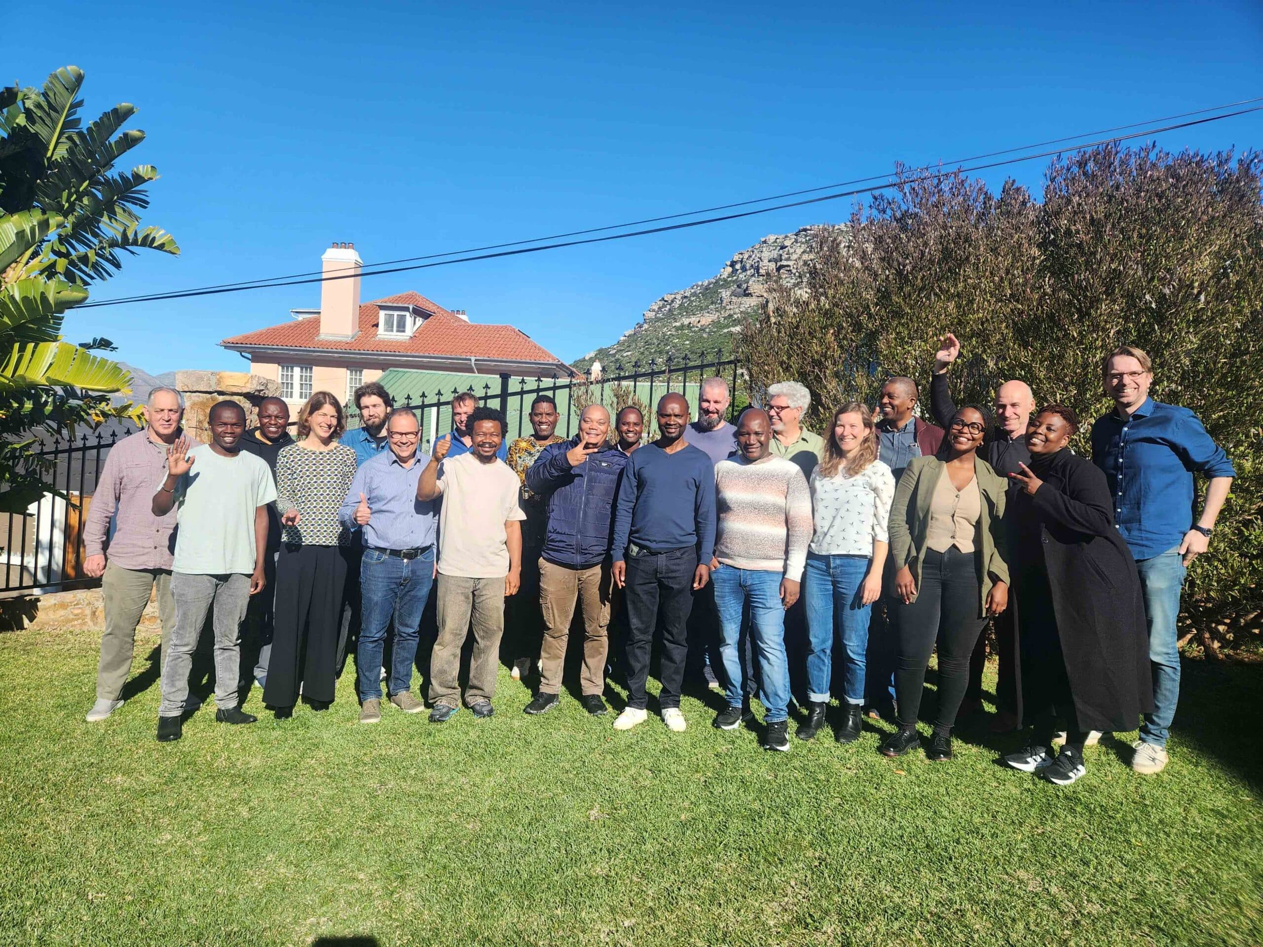 group of people posing for a group picture during a workshop