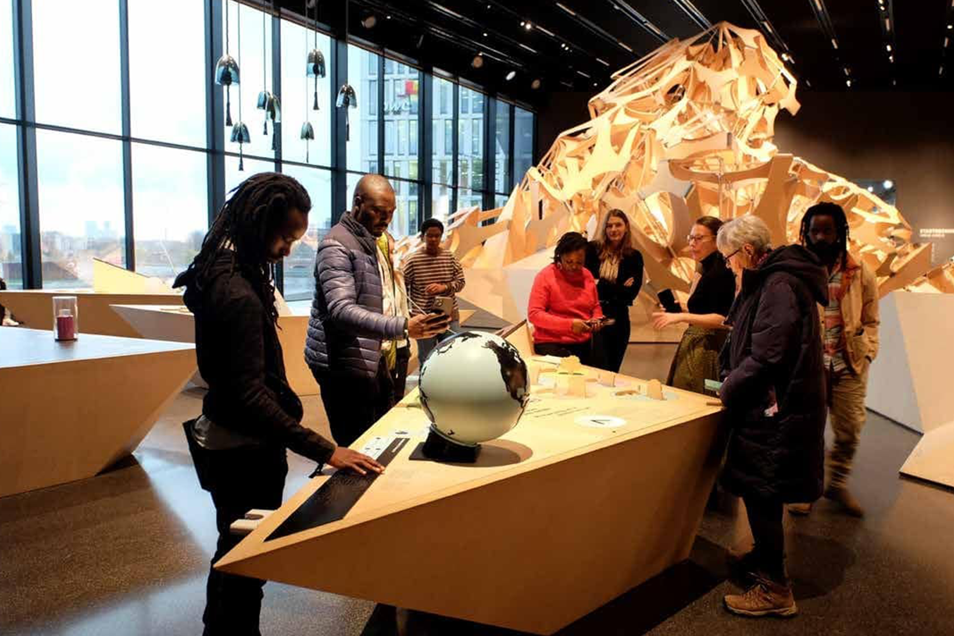 People standing around a table at a museum exhibition