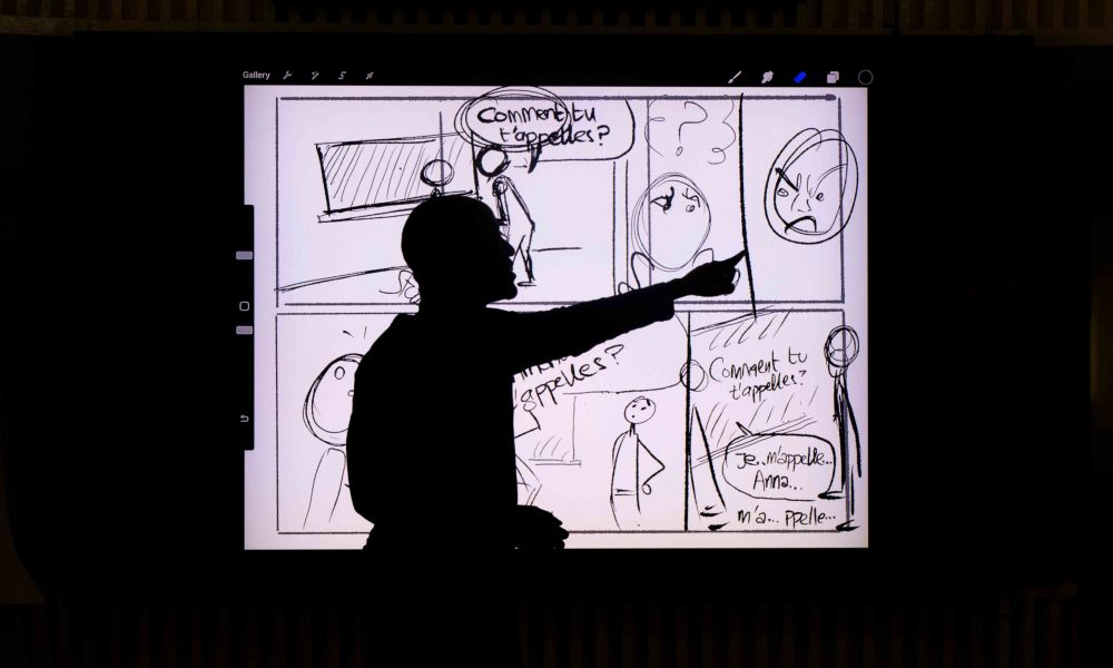 person in front of a screen